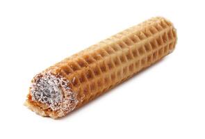 Delicious coconut-filled wafer roll rests on a clean surface, ready to be enjoyed as a sweet treat photo