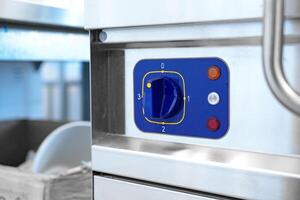 Control panel of a commercial kitchen machine showing settings for temperature and operation times photo