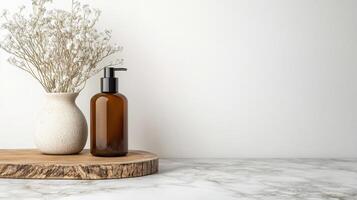 Elegant cosmetic bottle with dried flowers on marble surface photo