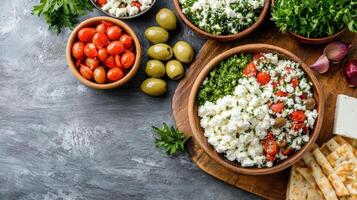 Fresh Greek dinner with olives, tomatoes, and herbs on wooden table photo