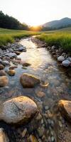 A river with a sun shining on it. The sun is in the sky and the water is clear photo