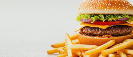 Classic Cheeseburger with Golden Fries, Mouth-watering cheeseburger topped with fresh vegetables, served alongside crispy golden fries, perfect for any meal photo
