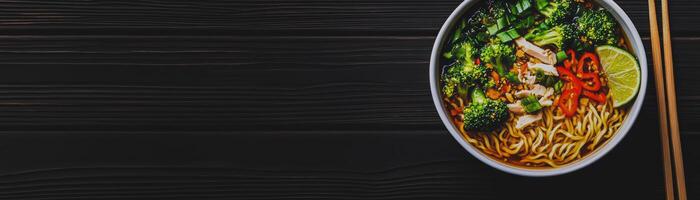 Delicious Bowl of Noodle Soup, Vibrant noodle soup topped with fresh vegetables, chicken, and garnished with lime and chili for perfect meal photo