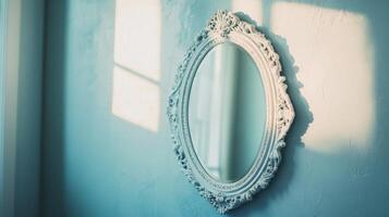 Reflection in a vintage mirror hangs on a wall in a softly lit room during late afternoon photo