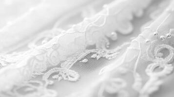 Delicate white lace fabric showcasing intricate patterns and details in soft lighting photo