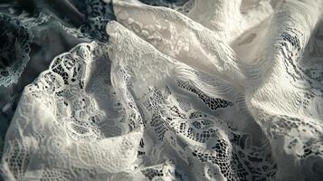 Delicate lace fabrics in white and black display intricate patterns and textures, perfect for various fashion and decor projects photo