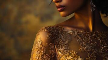 Elegant fashion display featuring intricate golden embroidery on a dress in a soft, warm lighting setting photo