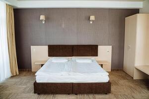 A bedroom with two beds and a dresser photo