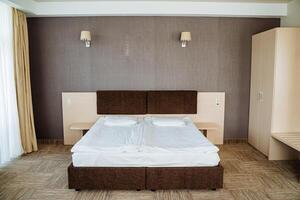 A bedroom with two beds and a dresser photo