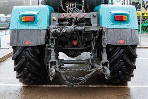 A tractor with a large chain attached to it photo