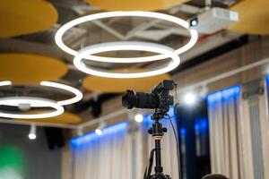 A camera is set up in front of a large room photo