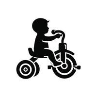 A black and white silhouette of a child riding a tricycle vector