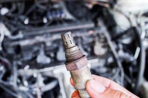 Oxygen sensor or O2 sensor of car engine , Automotive parts concept photo