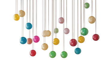 Colorful hanging orbs suspended from thin strings create a vibrant display in a bright indoor space, adding a playful atmosphere. png
