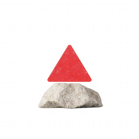 A red triangle resting on a textured rock, symbolizing balance and stability in design. png