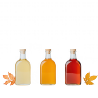 Three colored drink bottles with autumn leaves on a white background. png