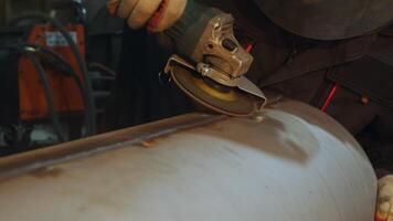 The Metalworking Process Utilizing an Angle Grinder on the Surface of a Pipe Component. Media video