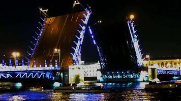 An Illuminated Drawbridge at Night with Beautiful Reflection in the Calm Water Below video