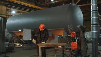 Industrial Worker Using Professional Welding Equipment in a Factory Setting to Create Products. Media video