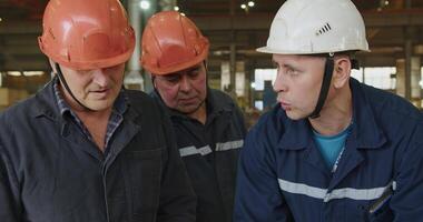 A Team of Workers Collaborating Effectively in a Manufacturing Setting for Success. Media video
