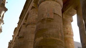 Large Egyptian columns with hieroglyphs in the ruined temple at Karnak video