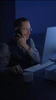 Dedicated and Focused Professional Working Late at Night on a Computer in Office Space video