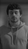 A Contemplative Young Man Invoked Through a Black and White Portrait Capturing Depth and Emotion video