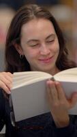 A Joyful Reader is Enjoying a Book While Relaxing in a Cozy, Comfortable Setting video