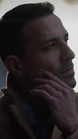 A contemplative and thoughtful man captured in a closeup portrait, displaying depth and character video