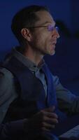 Dedicated and Focused Professional Working in a Dimly Lit Environment for Maximum Efficiency video