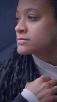 A Contemplative Woman in an Urban Setting with Beautiful Dreadlocks and Deep Thoughts video