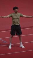 An athlete practices on an indoor track to improve skills, speed, and endurance video