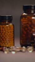 A Colorful Array of Bottles Filled with Various Supplements and Capsules on Display video