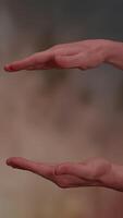 Hands are gesturing gracefully in empty space, providing a visual representation of concepts video