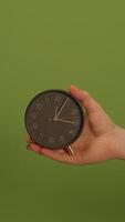 An Elegant and Stylish Clock on a Vibrant Green Background, Perfect for Any Setting video