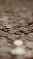 A Collection of Coins Displayed on a Surface for Observation or Sale and Analysis video