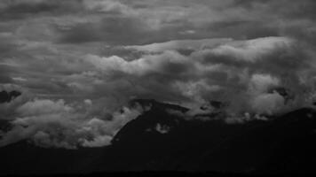 Monochrome Clouds Over a Stunning Mountain Landscape Evoke a Deep Sense of Wonder video