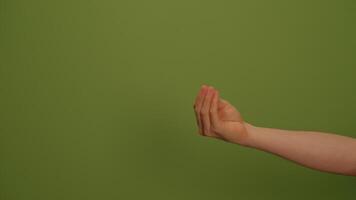 A Hand Gesture Displayed Against a Vibrant Green Background for a Captivating Visual Experience video