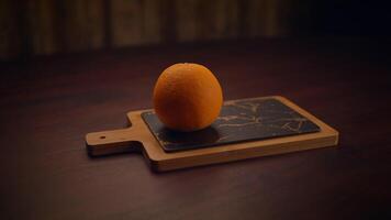 Hand Pressing Fresh Juicy Orange on a Beautiful Slate Cutting Board Intended for Cooking video