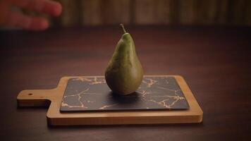 A beautifully arranged Fresh Pear displayed on a Marble Board in a charming Ambient Setting video