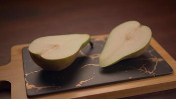 Freshly Sliced Pear Arranged Neatly on a Stylish Cutting Board, Ready to Enjoy and Devour video