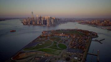 An Aerial View showcasing the Manhattan skyline along with Governors Island at Sunset time video