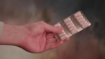 Generic prescription drugs on table top as macro camera moves slowly accross spilled pills and into the bottle. video
