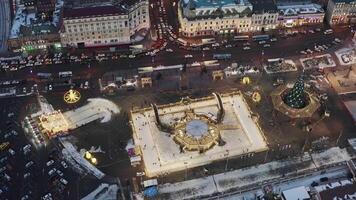 Aerial view of the square of Vladivostok with a skating rink and ice slides video