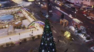 Drone view of the square of Vladivostok city with a skating rink and ice slides video