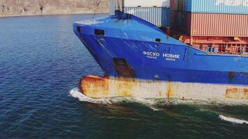 A close-up view of the bow of a container ship breaking waves video