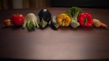 A Variety of Colorful Fresh Vegetables Arranged on a Rustic Wooden Table Surface video