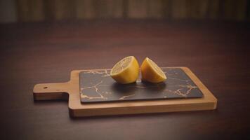 A sliced lemon rests elegantly on a stylish cutting board, ideal for any culinary use video