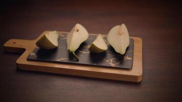 Freshly Sliced Pears Beautifully Arranged on a Wooden Cutting Board for Your Delight and Enjoyment video