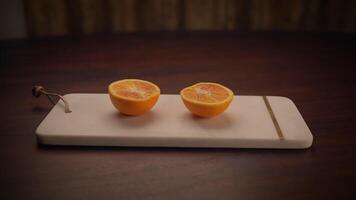 Freshly Cut Orange Halves Beautifully Arranged on a Rustic Wooden Board Ready to Enjoy video